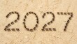 © TAHIR - Happy New Year 2027 Celebration Light Brown Sandy Soil .