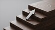 © Viqi - Metallic Arrow Pointing Upward on Wooden Steps Toward a Target