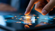 © Nataliya - Human hand placing a luminous puzzle piece into a transparent digital grid, strategic problem solving, innovation, business growth, creative thinking, technology consulting,