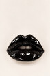 © Iryna Tkachenko - Glossy Black Lips with Dramatic Lipstick on Minimal Cream Background