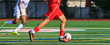 © coachwood - Soccer player dribbling the ball running down the field