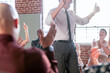 © Rawpixel.com - Middle-aged white male speaker leading an engaged diverse audience in a bright room