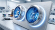 © Rahul - Modern metallic speaker system featuring dual glowing blue circular drivers sitting on a clean laboratory workbench