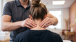 © RAAL - Professional massage therapist treating client neck pain in bright clinic studio