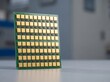 © Solonery Tech - Close up of a 64T64R massive MIMO active antenna planar array with gold plated patch elements on green circuit board for 5G telecommunication technology