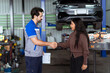 © DG PhotoStock - Mechanic shaking hands with female customer after vehicle service site