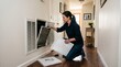 © Bruno Stock - Woman changing dirty air filter in home HVAC system for better indoor air quality and efficiency