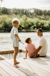 © BGStock72 - Joyful moments by the lake with family on a sunny afternoon