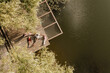 © BGStock72 - Relaxing by the serene waterside with friends amid nature's beauty