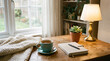© Marina - cozy self care space with cup of tea notebook and lamp on wooden table
