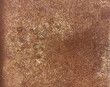 © somkcr - Close-up of golden rusty metal surface with grainy texture