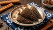 © PhanHuong - Dried Morel Mushrooms on Ceramic Plate with Spices and Blue Napkin