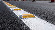 © Vera - Raised pavement marker installation on a newly painted road