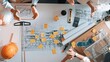 © InfiniteFlow - Top down view of smart civil engineer putting hand together at meeting table with house model. Aerial view of architect team working together while making stack of hand at meeting room. Alimentation.