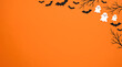 © Tania Akter - Halloween Background with Black Bats White Ghosts and Spooky Tree Branches on Vibrant Orange Paper Surface for Holiday Banner Poster and Copy Space