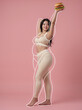 © iz_zi - Woman raising burger in diet and body transformation concept