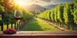 © udomsak - A glass of wine sits on a weathered wooden table surrounded by lush green vines and rows of grapevines in a picturesque vineyard landscape