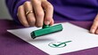 © millennium - Hand stamping green approval check mark on business document