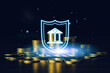 © Keaw - Stacks of gold coins with glowing bank and shield icon represent financial security, safe banking, asset protection, savings, investment, wealth management and economic stability.