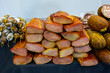 © Tatty - Pile off homemade cured dry pork meat outside in local market stall