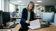 © l1gend - Financial controller at a desk reviewing a printed SOX testing log, Sarbanes-Oxley compliance and controls testing