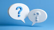 © Akash - White speech bubbles with blue question marks floating against a soft blue background. Perfect for FAQ and customer support concepts.