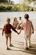 © BGStock72 - Family moments by the serene lake, capturing love and joy together