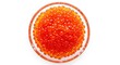 © ISRUNA - Closeup of vibrant red and orange caviar in a clear glass bowl on a white background food