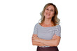 © Komora - Confident mature woman smiling, looking at camera with arms crossed, wearing striped shirt, transparent background
