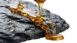© Hamza - Thick golden syrup pouring over a piece of textured black slate stone with food photography syrup pour honey drop food art liquid gold stone texture black rock viscosity