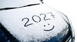 © guelant - Car hood covered in snow with 2027 written and smiley face