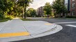 © Fauzan - Sidewalk curb ramp with tactile paving for accessibility on an urban residential street