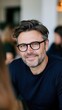 © Mind - Confident Middle-Aged Man with Glasses Smiling