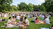© Hendy - People gathering in a green park for a summer concert on a sunny day