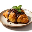 © YuumaSunamikaGoma - The classic deliciousness of a flaky baked croissant with a delicious chocolate drizzle