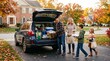 © PSCREATIVE - Family loading car with food for Thanksgiving gathering in autumn neighborhood