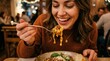 © Formoney - Young woman eating pasta happily in restaurant interior
