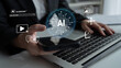 © InfiniteFlow - Modern technology concept showcasing digital AI assistant integration in daily life, featuring person interacting with smartphone and laptop in a professional environment. Glyphic.