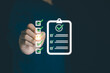 © MUNTHITA - Businessman using a digital online checklist survey, filling out digital form checklist. Take assessment, questionnaire, evaluation, online survey, online exam. Business performance checklist concept