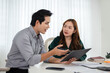 © Fahng - Two businesspeople Analyze financial data and accounting record with calculator in office,