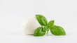 © PhotoHub - A fresh ball of mozzarella cheese with green basil leaves, isolated on white background
