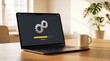© Hamad - Modern laptop screen displaying an active yellow loading progress bar with silver mechanical gear icons on a dark charcoal interface