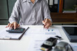 © Charlie's - Male Insurance Professional Assessing Damaged Car and Discussing Insurance Documents Representing Claims Service Financial Protection and Vehicle Coverage