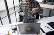© Charlie's - Computer Technician Repairing Desktop PC Hardware and Troubleshooting Technical Problems in Professional IT Service Workshop.