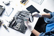 © Charlie's - Man Fixing and Repairing Desktop Computer PC Hardware Components During Professional Technology Maintenance Service.