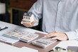 © Charlie's - Real Estate Broker Consulting Client About Home Insurance and Property Security During House Buying Process
