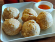 © Jaman - Close-up of fried meatballs on a white plate