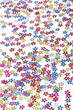 © toritori_moumou - Flower sequins confetti pattern scattered on white background