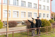 © BY-_-BY - Mature couple revisiting the school they attended in childhood