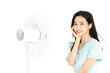 © KhangAnh - Smiling Woman Relaxing Beside Electric Standing Fan
